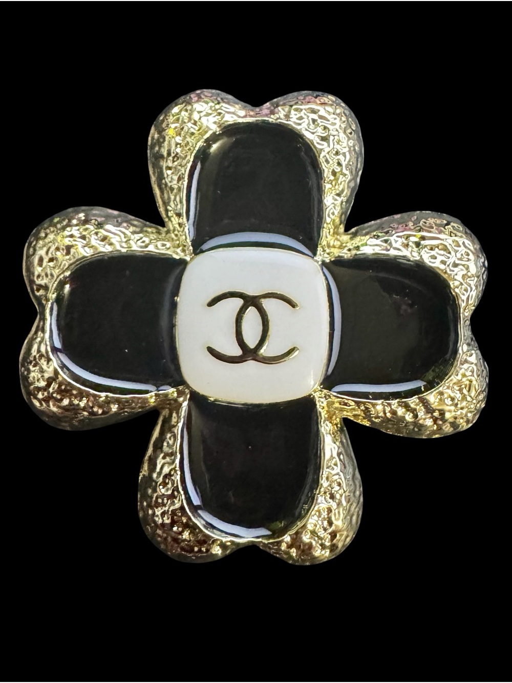 Black and Gold Flower Brooch Pin with White Logo Center